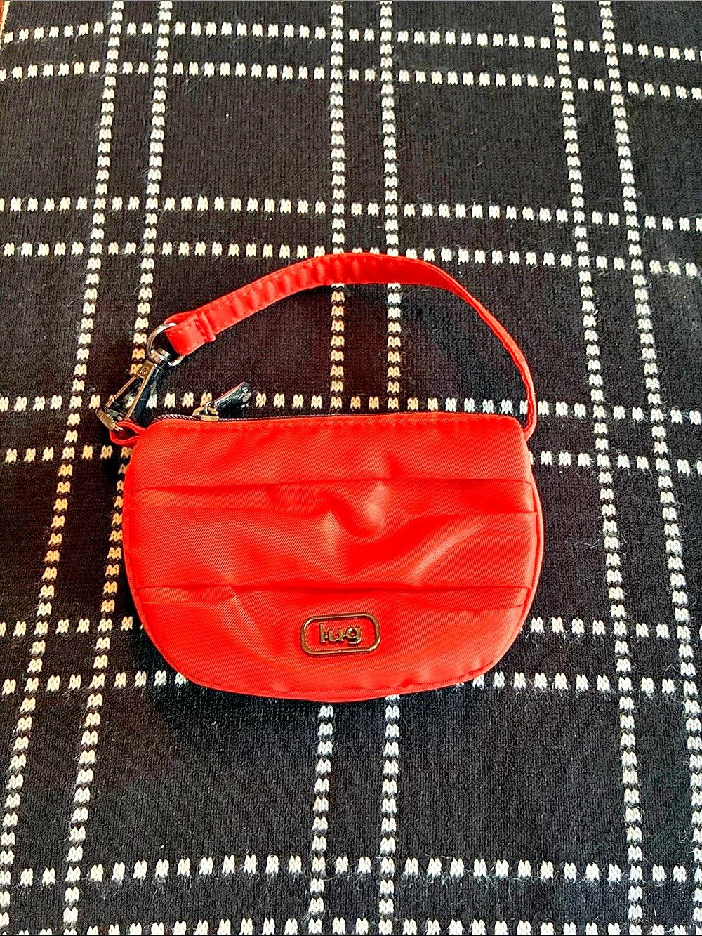 Lug Disco orange mini pleated pouch bag